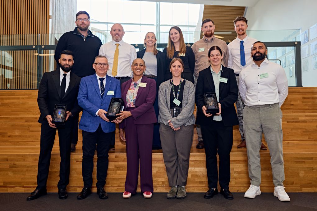 The Clear Hold Build team standing together being presented with their award.