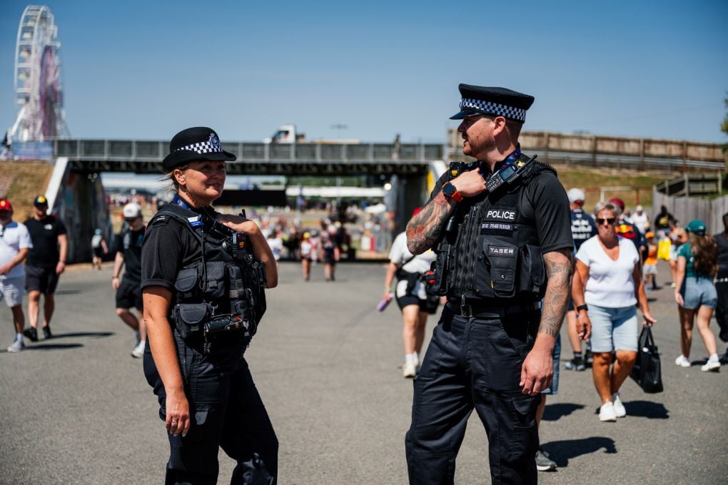 Two police officers on patrol at Silverstone circuit for the British Grand Prix